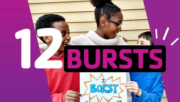 Kids holding a sign that says "I Burst" and smiling at each other